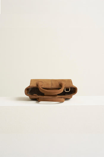 Small MIULIN Brunir suede tote bag displayed on a plain background, showcasing its soft texture and compact design.