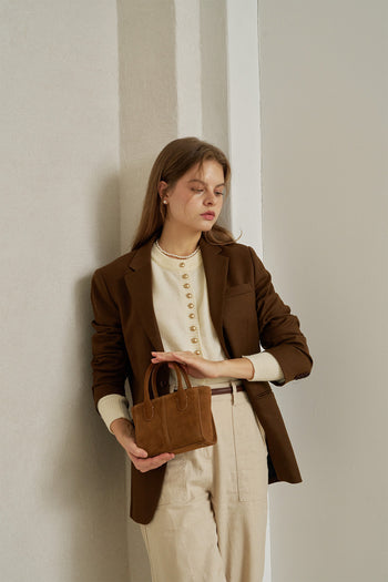 Small MIULIN Brunir suede bag with a sleek tote design, featuring a smooth texture and minimalist style.