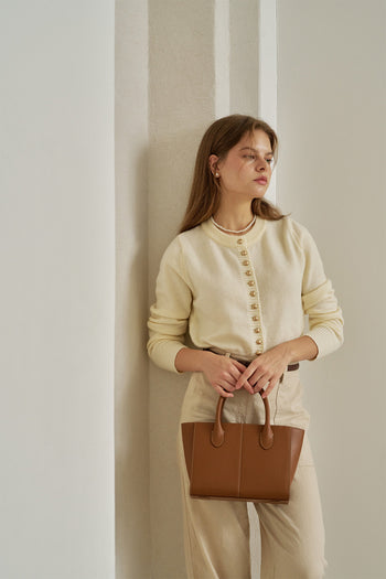 Medium Camille leather bag by MIULIN featuring a sleek design with top handles and a secure zipper closure.