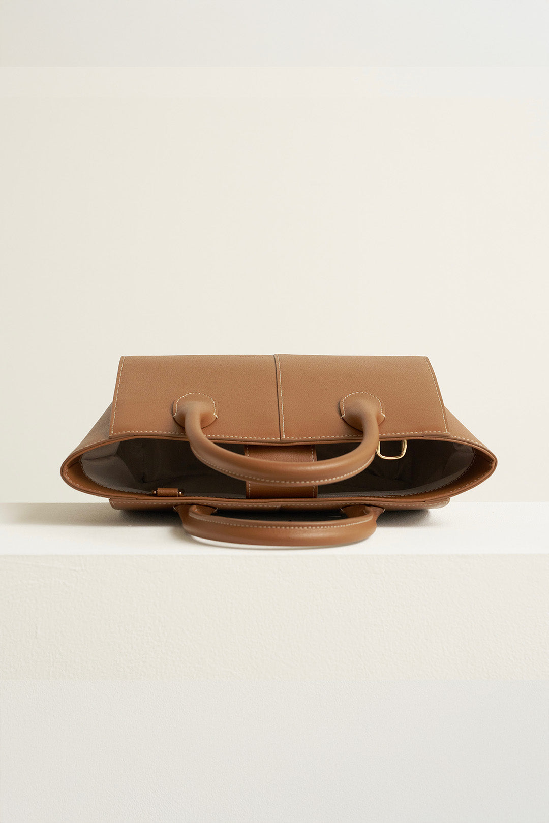 Medium Camille leather bag by MIULIN, featuring a sleek design with a top handle and spacious interior.