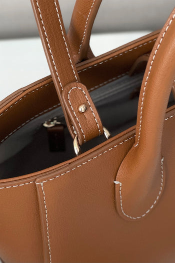 Medium Camille leather bag by MIULIN, showcasing the stylish tote with top handles and sleek design in natural leather.