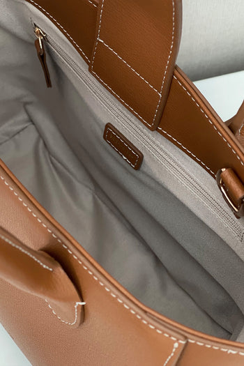 Medium Camille leather bag by MIULIN featuring a sleek design, top handle, and adjustable shoulder strap on a neutral background.