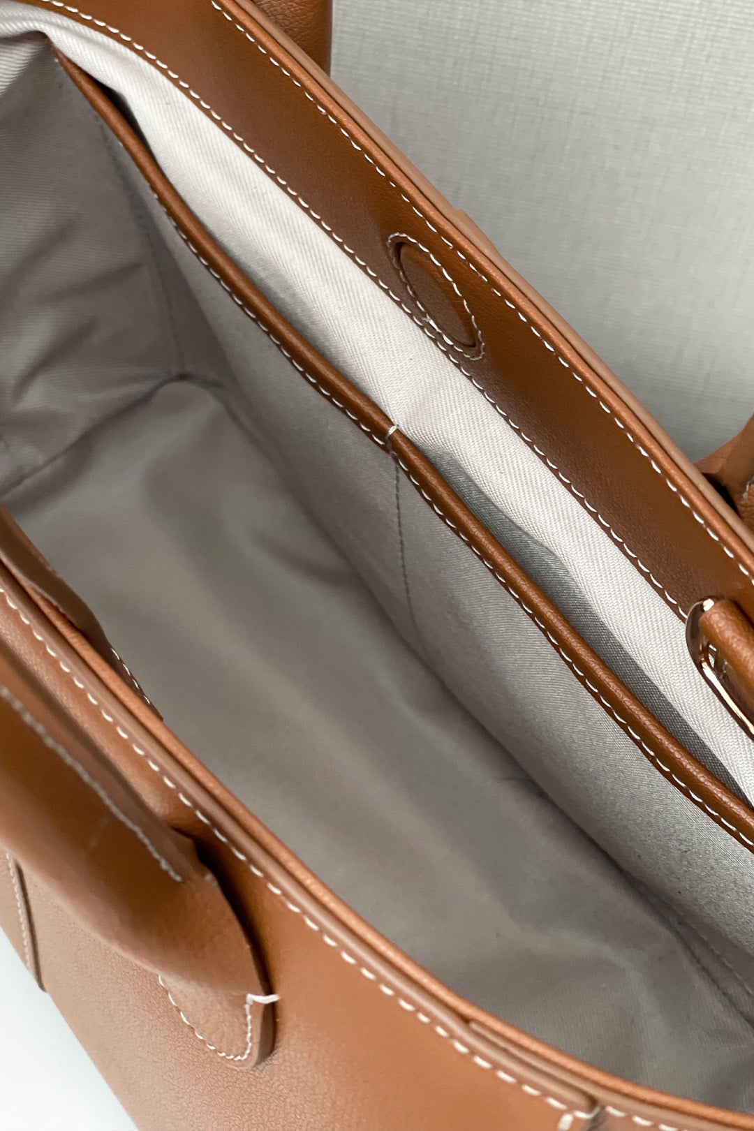 Medium Camille leather bag by MIULIN featuring sleek design and sturdy handles against a neutral background.