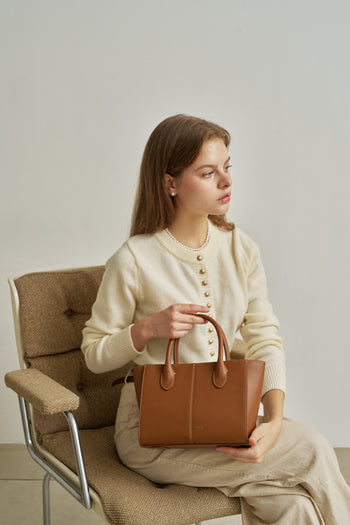 Medium Camille leather bag by MIULIN featuring a chic, structured design with top handles and sleek finish.