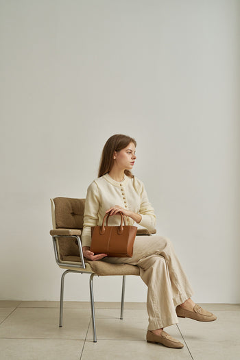Medium Camille leather bag by MIULIN, featuring a sleek design with top handles and a secure zipper closure.