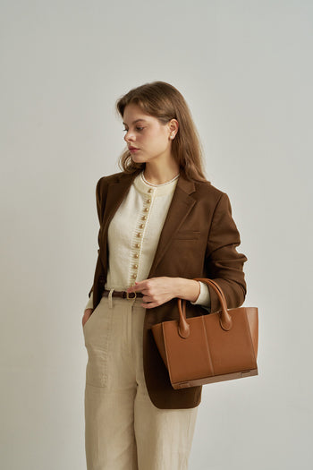 Medium Camille leather bag by MIULIN featuring a sleek design with top handles and a spacious interior.