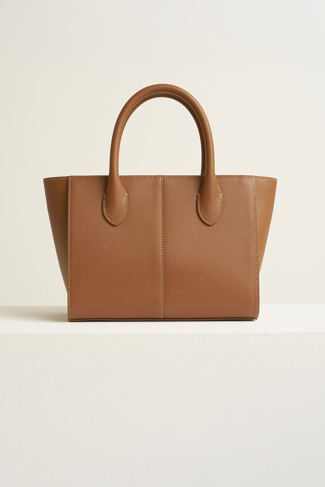 Medium Camille leather bag by MIULIN, featuring a stylish design with sturdy handles and sleek finish.