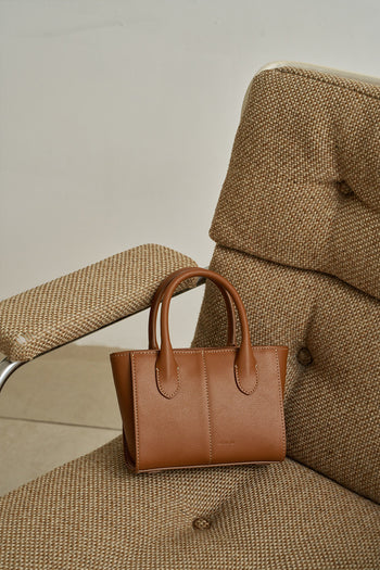 Small Camille leather bag by MIULIN featuring a sleek design with a top handle and compact shape.