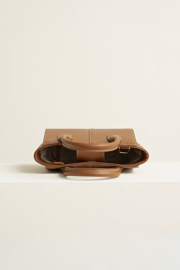 Small Camille leather bag by MIULIN featuring a sleek design with top handles and a structured silhouette.