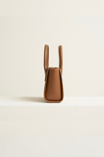 Small MIULIN Camille leather bag featuring a compact design with a sleek strap and textured leather finish.