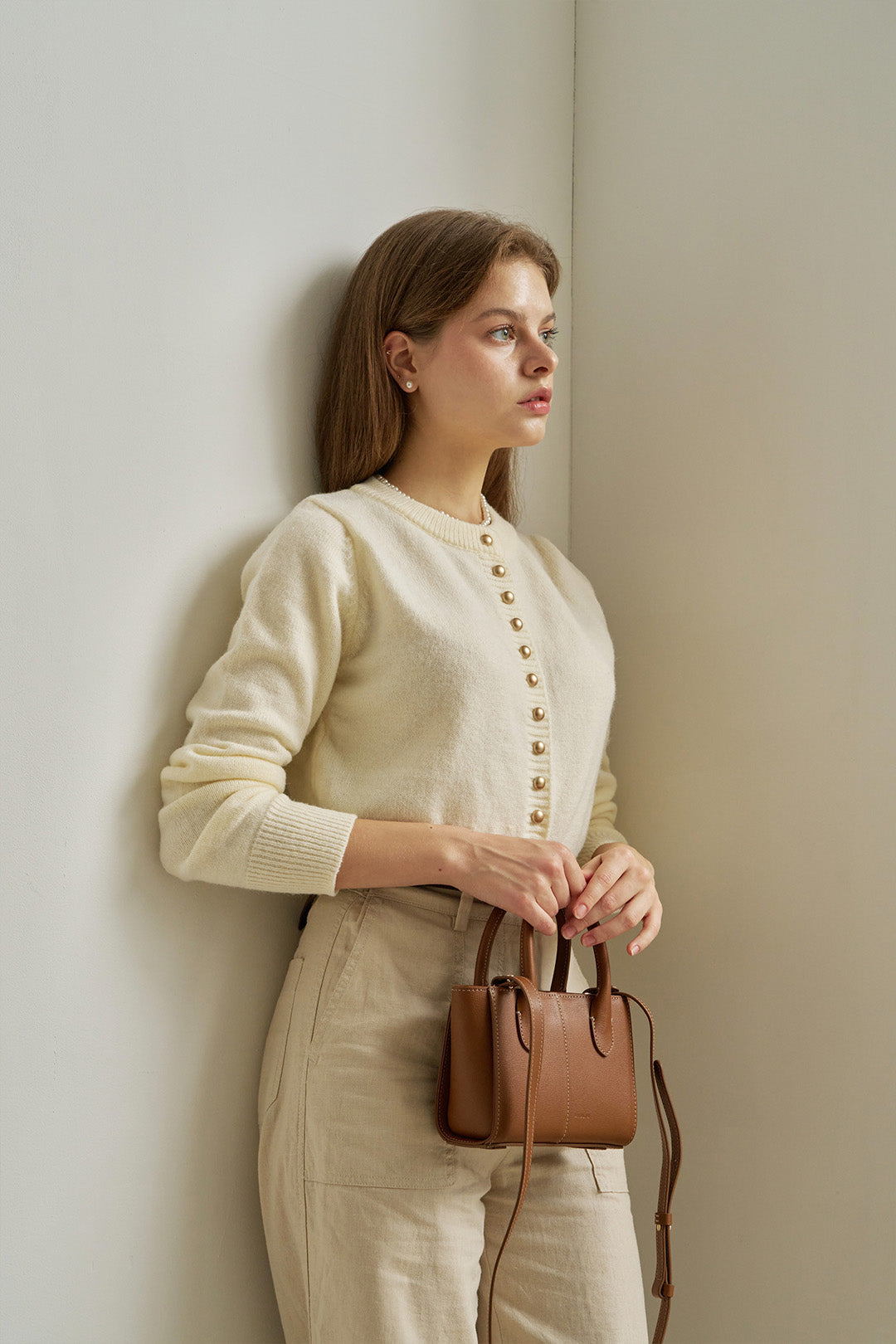 Small MIULIN Camille leather bag with sleek design, featuring a compact shape and elegant craftsmanship.
