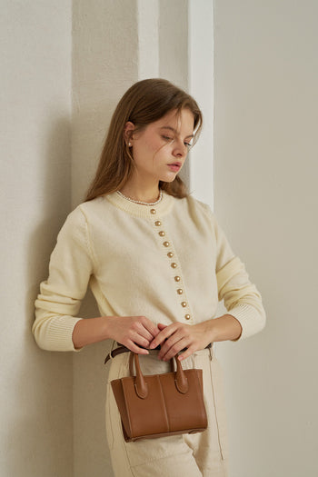 Small MIULIN Camille leather bag with top handle and sleek design, perfect for everyday use.