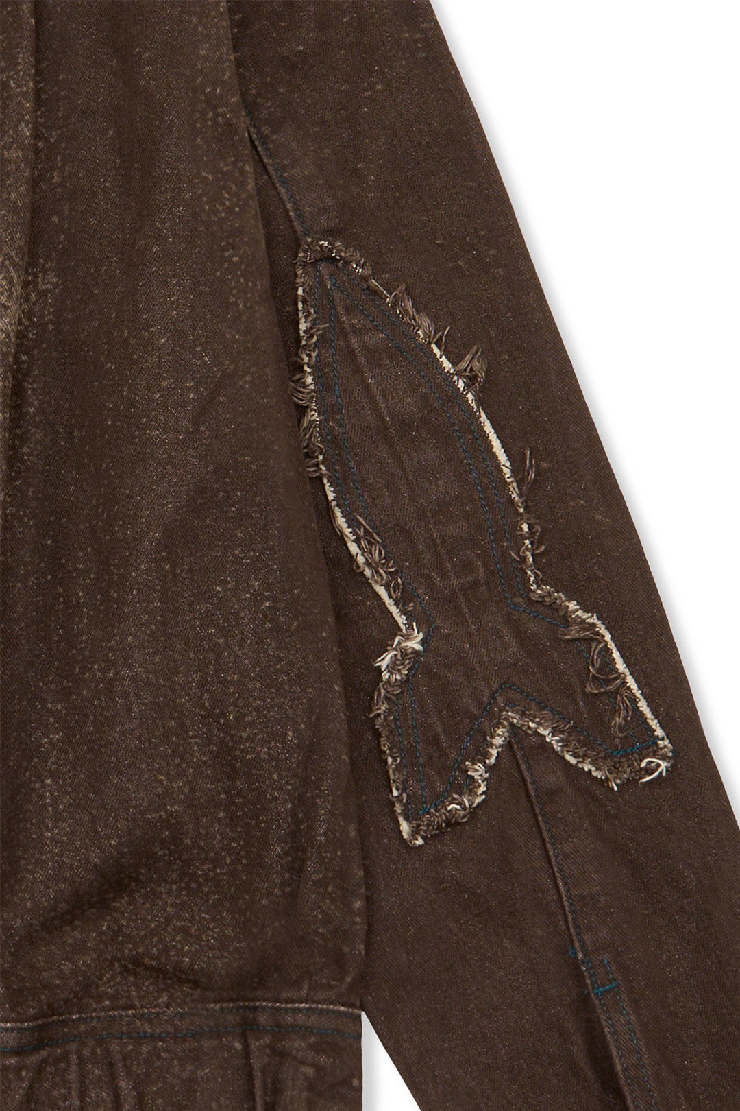 Laser-engraved Crash Bloom jacket by IOEDLE, featuring detailed floral design, displayed on a hanger against a neutral background.