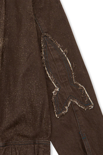Laser-engraved Crash Bloom jacket by IOEDLE, featuring detailed floral design, displayed on a hanger against a neutral background.