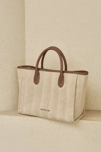 Large beige creamed canvas tote bag by MIULIN with sturdy handles and spacious interior for everyday use.