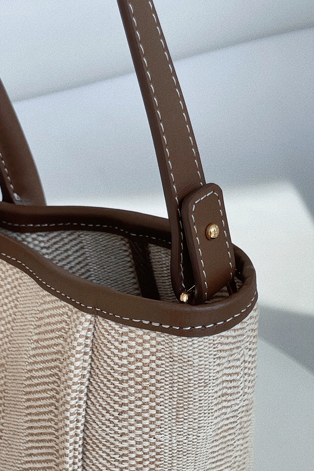 Large beige creamed canvas bag by MIULIN with sturdy handles and spacious interior, ideal for daily use and casual outings.