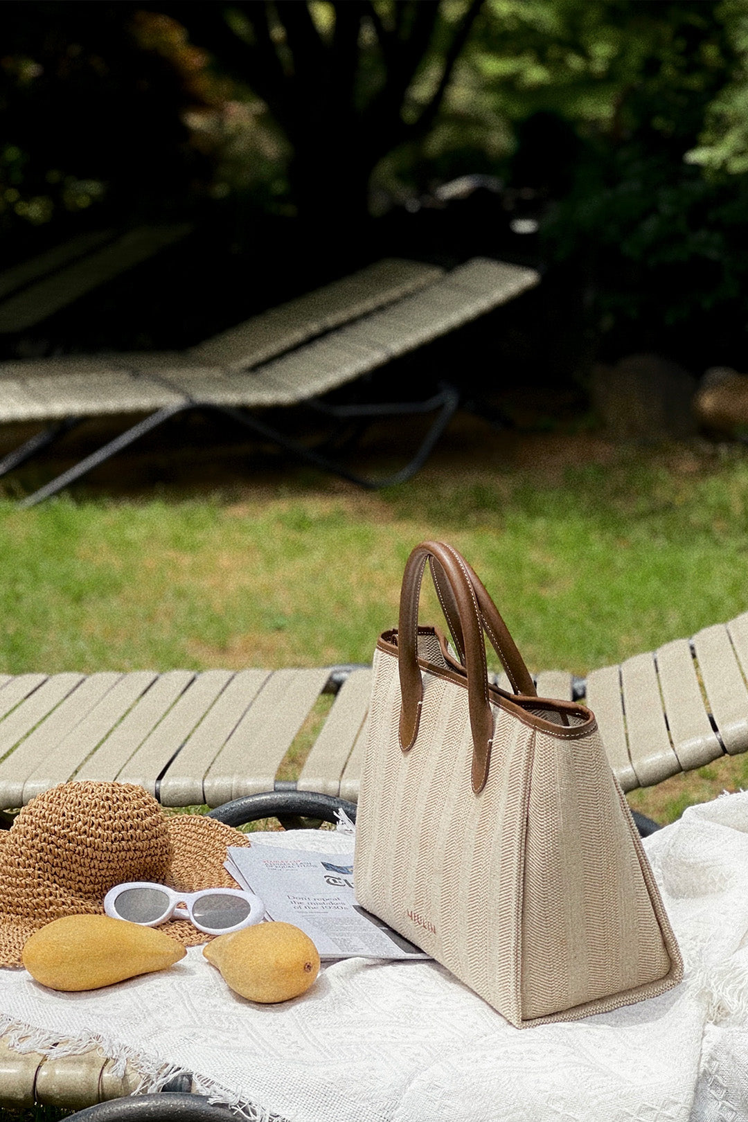 Large beige creamed canvas tote bag by MIULIN with sturdy handles and spacious interior for daily use.