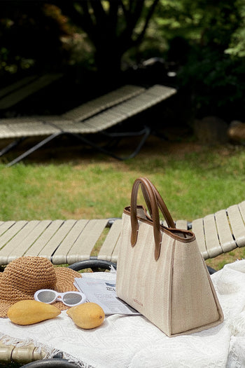 Large beige creamed canvas tote bag by MIULIN with sturdy handles and spacious interior for daily use.