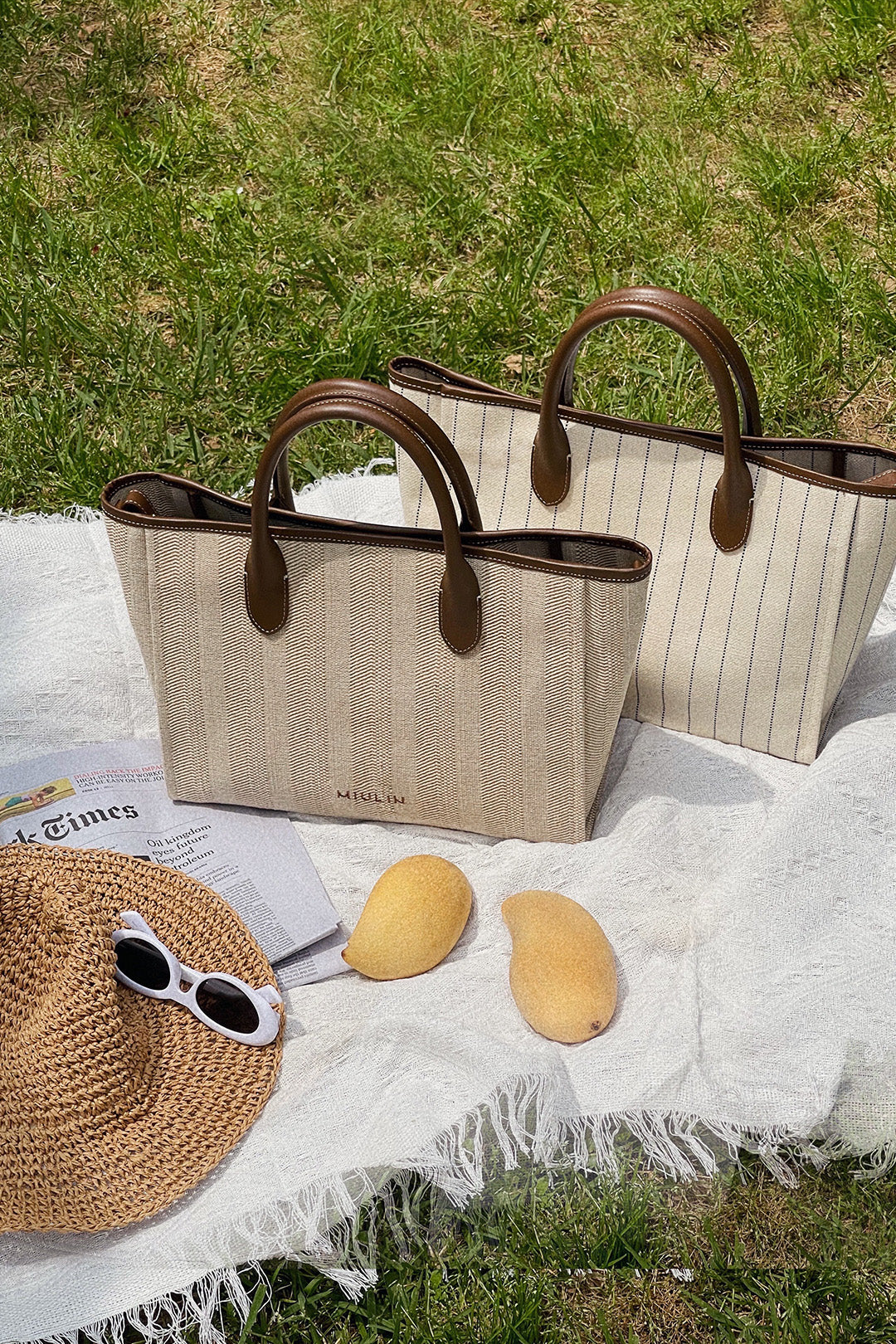 Large beige creamed canvas tote bag by MIULIN with sturdy handles and spacious interior for everyday use.
