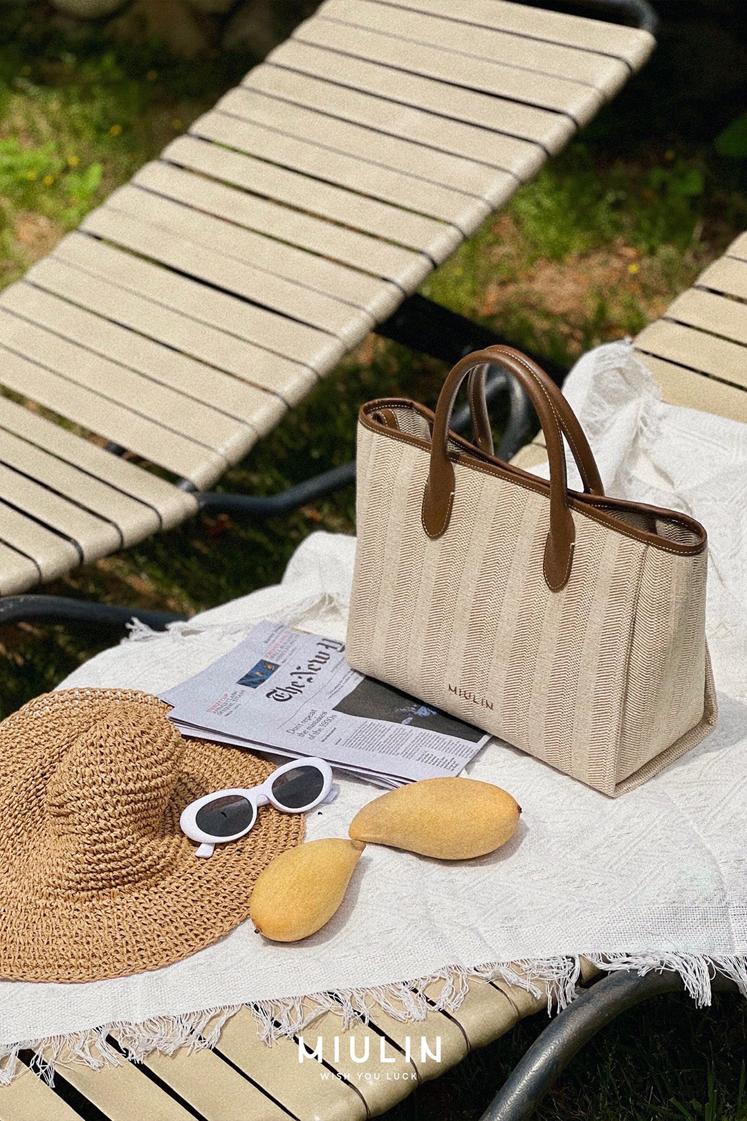 Large beige creamed canvas tote bag by MIULIN with sturdy handles and spacious interior for everyday use.