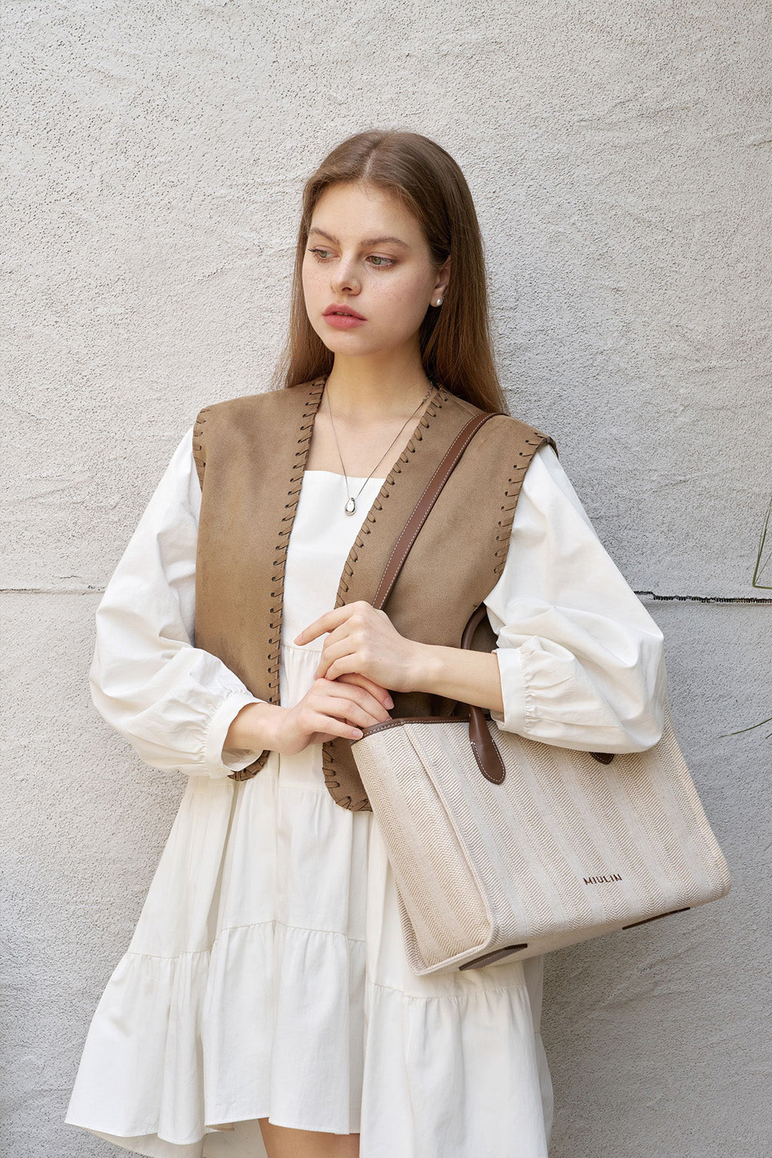 Large beige creamed canvas tote bag by MIULIN with sturdy handles and spacious interior for everyday use.