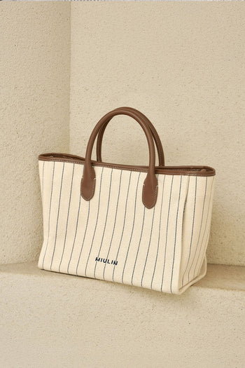 Large striped creamed canvas tote bag by MIULIN showing sturdy handles and a spacious interior for everyday use.