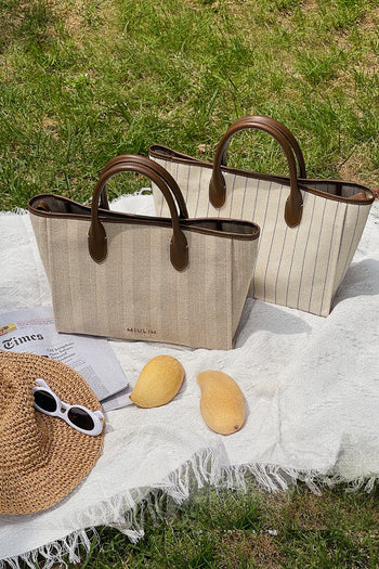 Large creamed canvas tote bag with stripe design by MIULIN, showing soft fabric and spacious interior for everyday use.