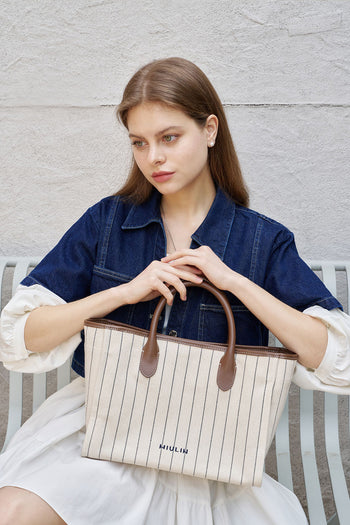 Large creamed canvas tote bag with stripe design by MIULIN, showing sturdy handles and spacious interior.
