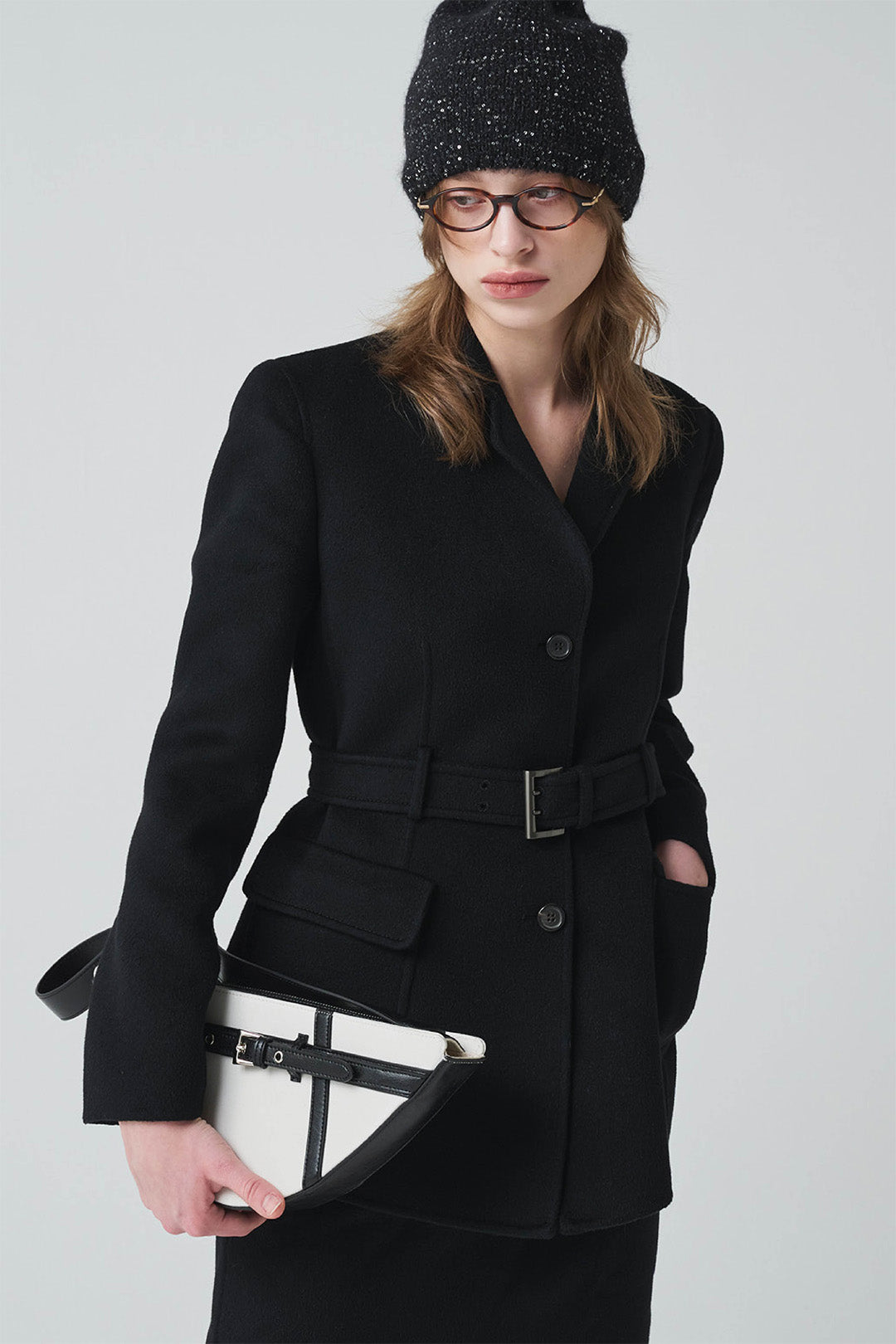 Black LE SAUT GOCI Bag featuring a sleek design, sturdy handles, and stylish texture.