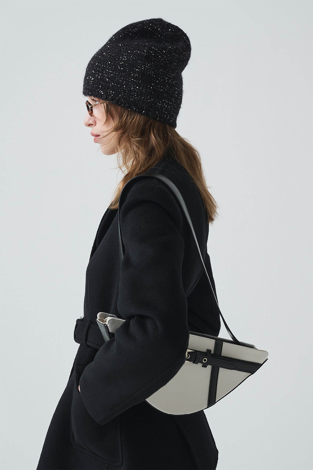 Black LE SAUT GOCHI bag with sleek design, featuring sturdy handles and spacious interior for everyday use.