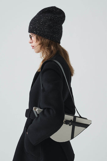 Black LE SAUT GOCHI bag with sleek design, featuring sturdy handles and spacious interior for everyday use.