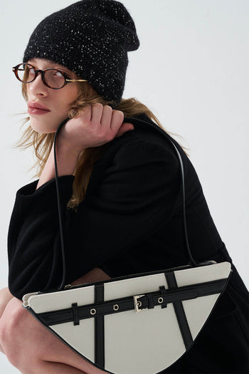 Black LE SAUT GOCHI bag with sleek design, featuring a compact shape and stylish handle, shown on a plain background.