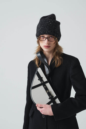Black LE SAUT GOCHI Bag with sleek design and top handle, featuring minimalistic style and secure zipper closure.