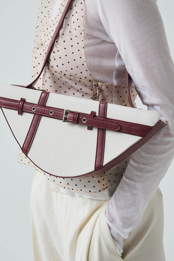 Deep red GOCHI Bag by LE SAUT featuring a sleek design with sturdy handles and a spacious interior.