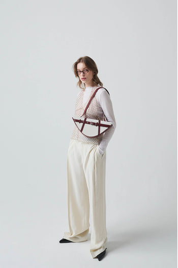Deep red LE SAUT GOCHI bag showing sleek design and sturdy handles, perfect for stylish everyday use.