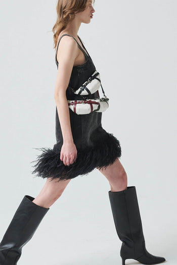 LE SAUT GOCHI Mini Bag in sleek design, showcasing its compact size and stylish exterior with a top handle and zipper closure.