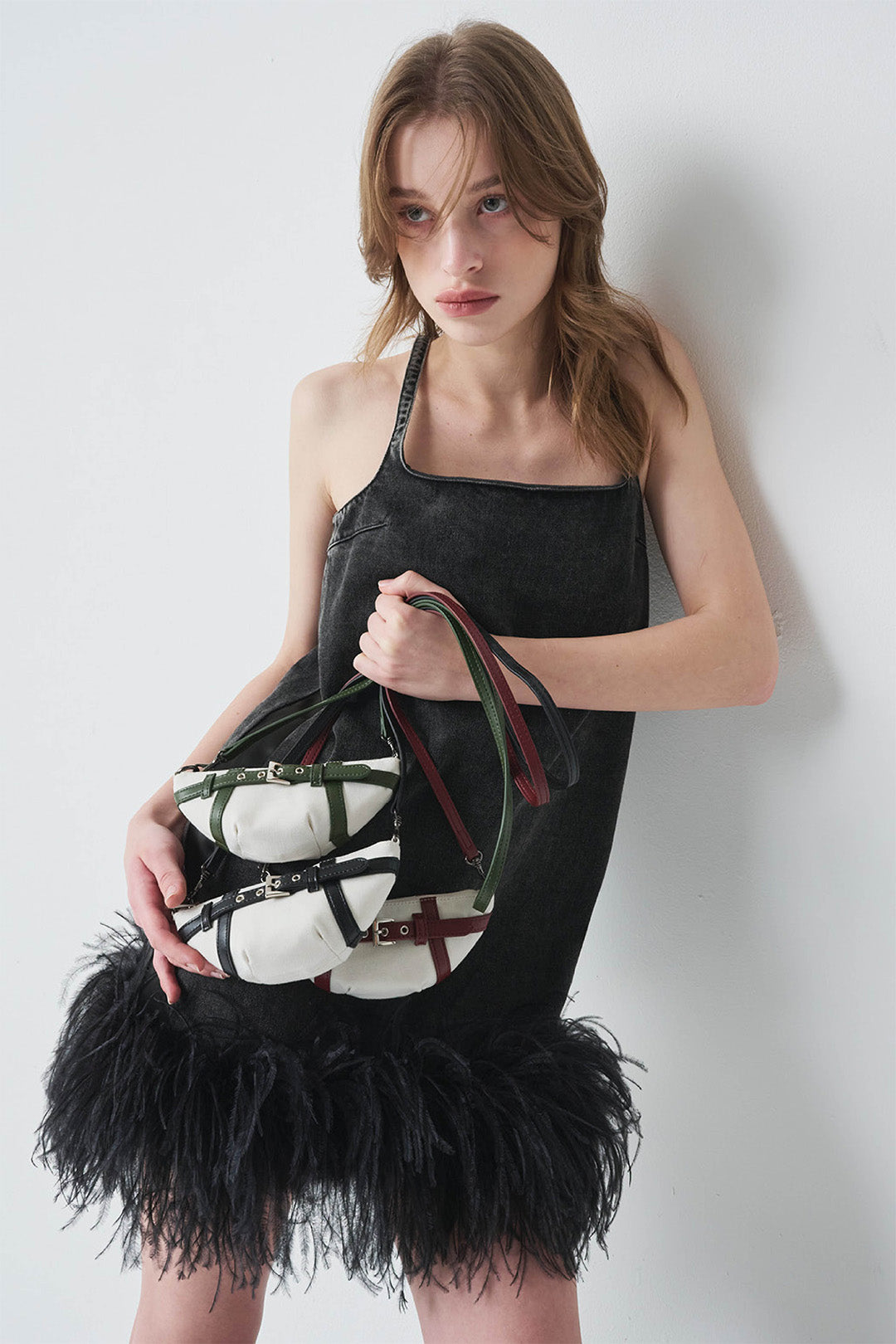 LE SAUT GOCHI Mini Bag with sleek design, featuring compact size and stylish black exterior for versatile everyday use.