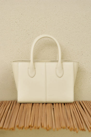 Medium Ivoire leather tote bag by MIULIN with sturdy handles and smooth finish, perfect for everyday use.