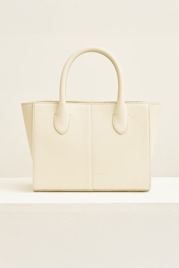 Medium Ivoire leather tote bag by MIULIN, showing the stylish beige handbag with handles and spacious interior.