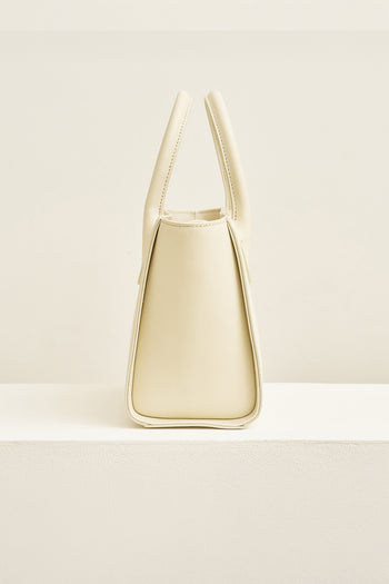 Medium Ivoire leather tote bag by MIULIN with sleek design and sturdy handles, perfect for everyday use.