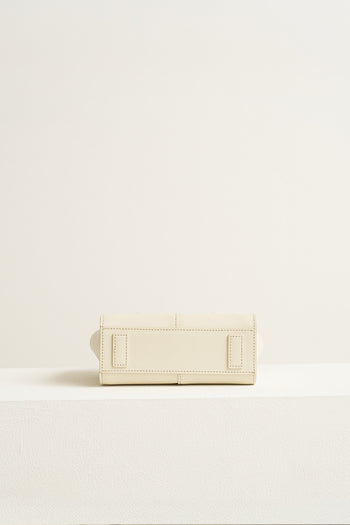 Small Ivoire leather tote bag by MIULIN, featuring smooth ivory leather with sturdy handles and minimalist design.