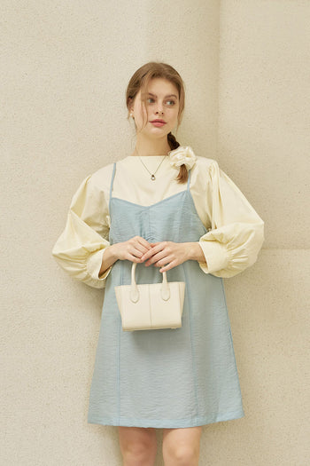 Small Ivoire leather bag by MIULIN featuring a sleek tote design with sturdy handles and smooth leather finish.