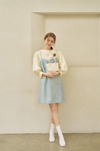 Small Ivoire leather bag by MIULIN featuring a sleek design, top handle, and elegant ivory color for stylish everyday use.