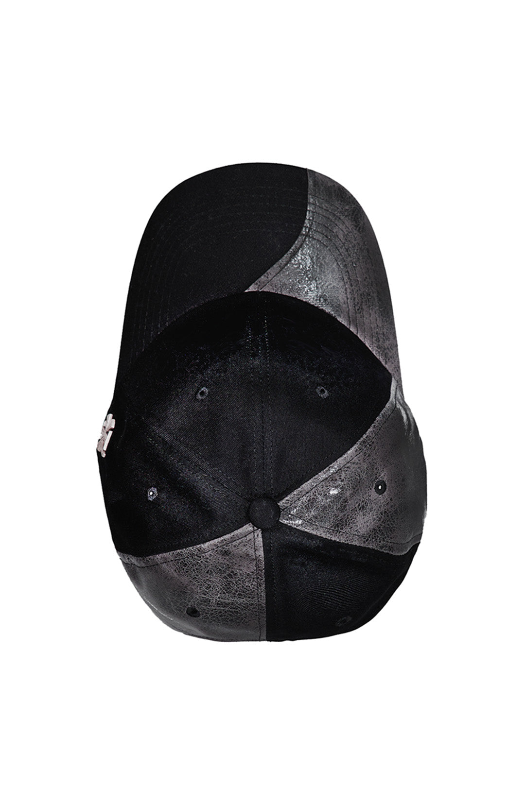 Black asymmetric raw creviced cap by KIMMICK, featuring a unique design with textured fabric and modern style.