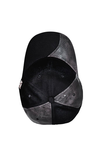 Black asymmetric raw creviced cap by KIMMICK, featuring a unique design with textured fabric and modern style.