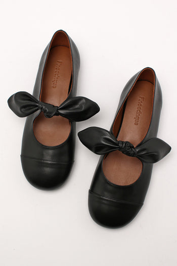 Finoacinque Lina Ribbon Maryjane black flat shoes with ribbon details and rounded toe, shown from a side angle.