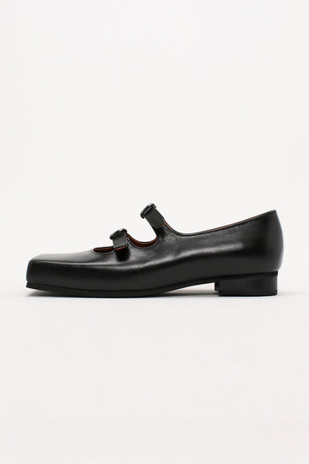 Black Nora strap flat shoes by Finoacinque featuring a sleek design and comfortable flat sole, shown on a plain background.