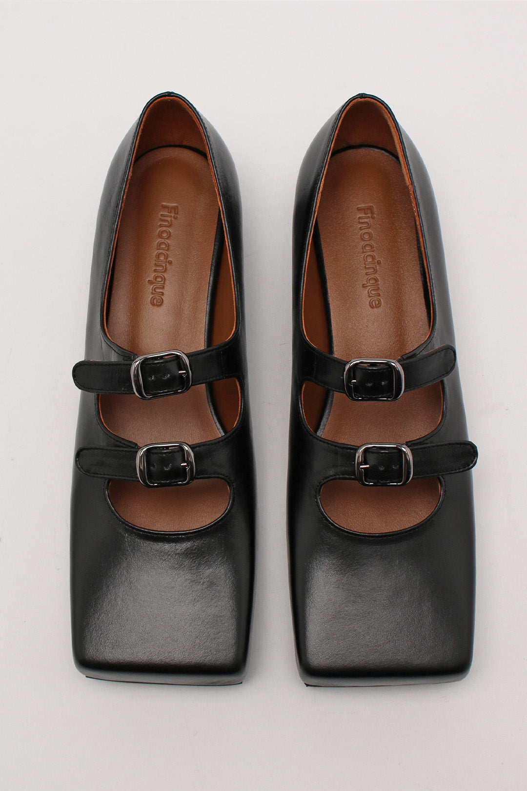 Black Nora strap flat shoes by Finoacinque featuring a sleek design and comfortable flat sole, shown on a plain background.