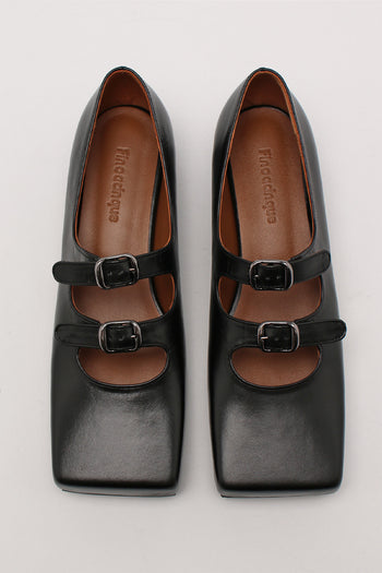 Black Nora strap flat shoes by Finoacinque featuring a sleek design and comfortable flat sole, shown on a plain background.