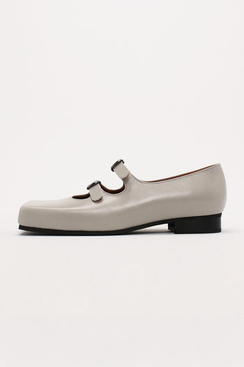 Light gray Nora strap flat shoes by Finoacinque featuring a sleek design and comfortable flat sole.